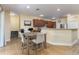 Dining area with wood table and chairs next to the kitchen at 420 Tulipwood Ln, Chuluota, FL 32766