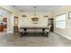 Charming dining area with a wooden table, bench seating, and decorative shelves at 420 Tulipwood Ln, Chuluota, FL 32766