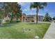 Inviting home boasts lush lawn, mature trees, and tidy landscaping at 420 Tulipwood Ln, Chuluota, FL 32766