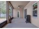 Enclosed lanai with sliding glass door and neutral colored walls at 420 Tulipwood Ln, Chuluota, FL 32766