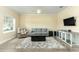 Inviting living room with a ceiling fan, area rug, and neutral tones for a relaxing atmosphere at 420 Tulipwood Ln, Chuluota, FL 32766