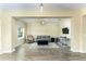 Comfortable living room featuring wood floors, a plush sofa, and a decorative area rug at 420 Tulipwood Ln, Chuluota, FL 32766