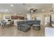 Inviting living room with open-concept design, neutral color palette, and wood-look tile floors at 420 Tulipwood Ln, Chuluota, FL 32766