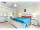 Tranquil main bedroom featuring carpeted floors, a bedside table, and access to an ensuite bathroom at 420 Tulipwood Ln, Chuluota, FL 32766