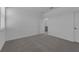 Cozy bedroom with neutral carpeting, an open ensuite bathroom and a double door closet for storage at 502 Belmond Dr, Debary, FL 32713