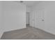 Neutral bedroom featuring plush carpeting, white walls, and bright natural light at 502 Belmond Dr, Debary, FL 32713