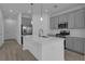 Modern kitchen featuring gray cabinetry, stainless steel appliances, and a large center island with pendant lighting at 502 Belmond Dr, Debary, FL 32713