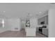Open-concept kitchen with gray cabinets, stainless steel appliances, and a center island at 502 Belmond Dr, Debary, FL 32713