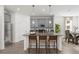 Modern kitchen with gray cabinets, granite countertops, stainless steel appliances and island seating at 502 Belmond Dr, Debary, FL 32713