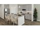 Modern kitchen with gray cabinets, granite countertops, stainless steel appliances and pendant lighting at 502 Belmond Dr, Debary, FL 32713