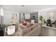 Bright open-concept living room with gray cabinets, stainless appliances and a dining nook at 502 Belmond Dr, Debary, FL 32713