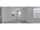 Living room with hard floors and two large windows at 502 Belmond Dr, Debary, FL 32713