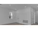 Spacious living room with wood-look flooring, recessed lighting, and two interior doors at 502 Belmond Dr, Debary, FL 32713