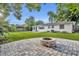 Wide backyard featuring a stone fire pit area and lush greenery at 504 W Faith Ter, Maitland, FL 32751