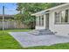 Backyard patio with stone pavers and steps leading to the yard at 504 W Faith Ter, Maitland, FL 32751