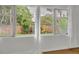 Window view of the fenced backyard, lush greenery, and a serene outdoor space at 504 W Faith Ter, Maitland, FL 32751