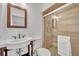 Bathroom featuring pedestal sink, glass-enclosed shower, and neutral tile at 504 W Faith Ter, Maitland, FL 32751