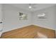 Empty bedroom featuring wood floors, white walls, and natural light from windows at 504 W Faith Ter, Maitland, FL 32751