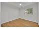 Cozy bedroom with hardwood floors, a ceiling fan, and a window providing natural light at 504 W Faith Ter, Maitland, FL 32751