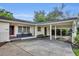 Exterior view of the home showing the front porch and covered parking at 504 W Faith Ter, Maitland, FL 32751