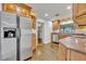 Spacious kitchen equipped with stainless steel appliances and warm wooden cabinetry at 504 W Faith Ter, Maitland, FL 32751