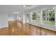 Spacious living room featuring hardwood floors, white walls, and multiple windows at 504 W Faith Ter, Maitland, FL 32751