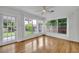 Light-filled sun room with multiple windows and views of the landscaped backyard at 504 W Faith Ter, Maitland, FL 32751
