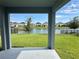 A covered back porch overlooking a beautiful pond and backyard at 5054 Tibet Ct, St Cloud, FL 34772