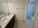 Bathroom featuring a double sink vanity and shower tub combination, perfect for daily routines and relaxation at 5054 Tibet Ct, St Cloud, FL 34772