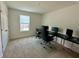 Bedroom featuring neutral walls, carpet, and natural light, perfect for a home office setup with two desks at 5054 Tibet Ct, St Cloud, FL 34772