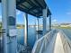 Community boat lift features a covered structure and convenient access to the water at 5054 Tibet Ct, St Cloud, FL 34772