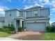 Lovely home with a brick driveway, tidy landscaping and a two-car garage at 5054 Tibet Ct, St Cloud, FL 34772