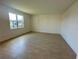 Bright living room features tile flooring and large window at 5054 Tibet Ct, St Cloud, FL 34772