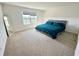Bright main bedroom with view, plush carpet, and modern furnishings at 5054 Tibet Ct, St Cloud, FL 34772