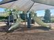Community playground with slides, climbing structures, and protective shade covering at 5054 Tibet Ct, St Cloud, FL 34772