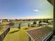 Scenic view of the lake showcasing stunning houses, a private boat dock, and outdoor entertaining spaces at 5054 Tibet Ct, St Cloud, FL 34772