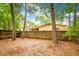 Backyard featuring mature shade trees, well maintained landscape, and a privacy fence at 508 W Plantation Blvd, Lake Mary, FL 32746