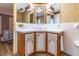 Bathroom with a vanity, cabinets, and bright lighting, offering ample storage at 508 W Plantation Blvd, Lake Mary, FL 32746