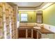 Bathroom vanity featuring a sink, ample cabinet space and a decorative shower curtain at 508 W Plantation Blvd, Lake Mary, FL 32746