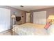 A bedroom featuring a full bed, closet, tv and ample lighting at 508 W Plantation Blvd, Lake Mary, FL 32746