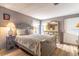 Bedroom features a full bed, dresser with large mirror, and natural lighting at 508 W Plantation Blvd, Lake Mary, FL 32746