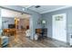 Welcoming entryway with laminate flooring, decorative accents, and seamless access to the living area at 508 W Plantation Blvd, Lake Mary, FL 32746