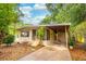 Inviting home with a screened porch, covered parking and lovely mature trees at 508 W Plantation Blvd, Lake Mary, FL 32746
