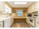Well-lit kitchen featuring white appliances, lots of counter space and neutral paint at 508 W Plantation Blvd, Lake Mary, FL 32746