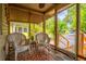 Relaxing screened porch with comfortable seating and a view of the surrounding landscape at 508 W Plantation Blvd, Lake Mary, FL 32746