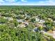 An aerial of the neighborhood with plentiful mature trees and manicured lawns at 626 Pearl Rd, Winter Springs, FL 32708
