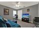 Bedroom with a comfortable sofa and workstation, providing a versatile space for relaxation and work at 626 Pearl Rd, Winter Springs, FL 32708