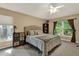 Cozy bedroom with ample natural light, ceiling fan, and comfortable furnishings at 626 Pearl Rd, Winter Springs, FL 32708