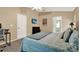 Relaxing bedroom featuring soft tones, a TV for entertainment, and access to the en-suite bathroom at 626 Pearl Rd, Winter Springs, FL 32708
