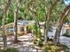 Single story exterior showing manicured landscaping and private drive at 626 Pearl Rd, Winter Springs, FL 32708